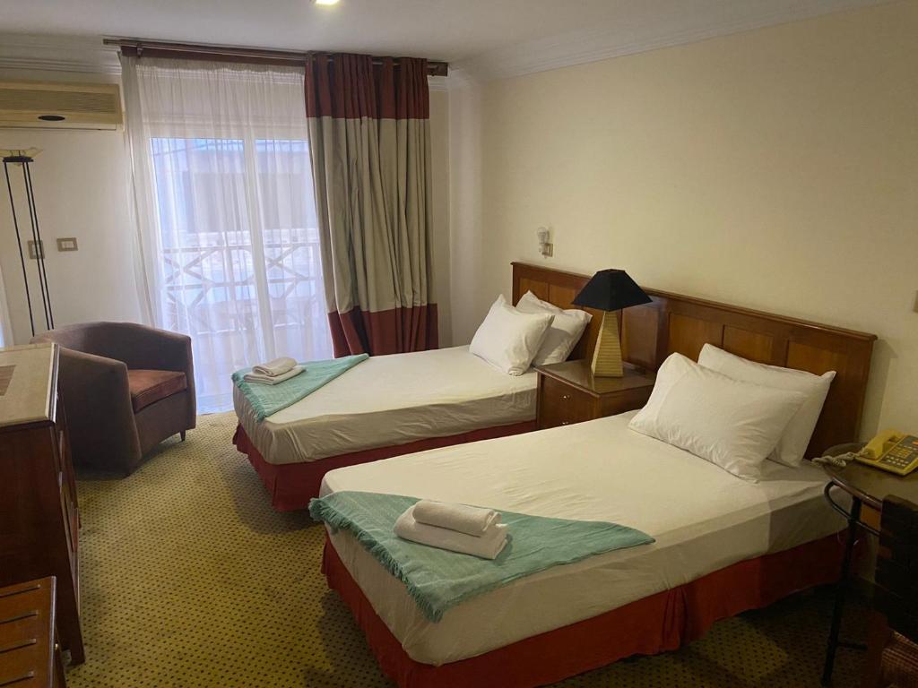 Postel nebo postele na pokoji v ubytování Bianchi Hotel
