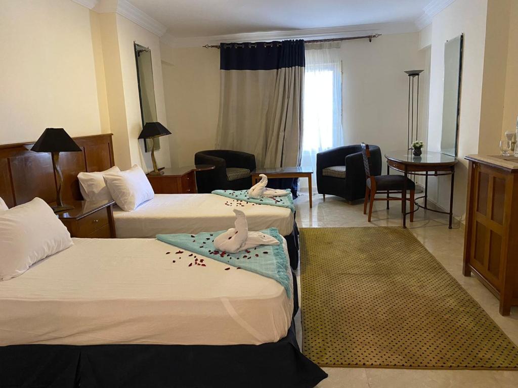 Postel nebo postele na pokoji v ubytování Bianchi Hotel