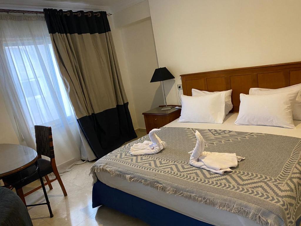 Postel nebo postele na pokoji v ubytování Bianchi Hotel