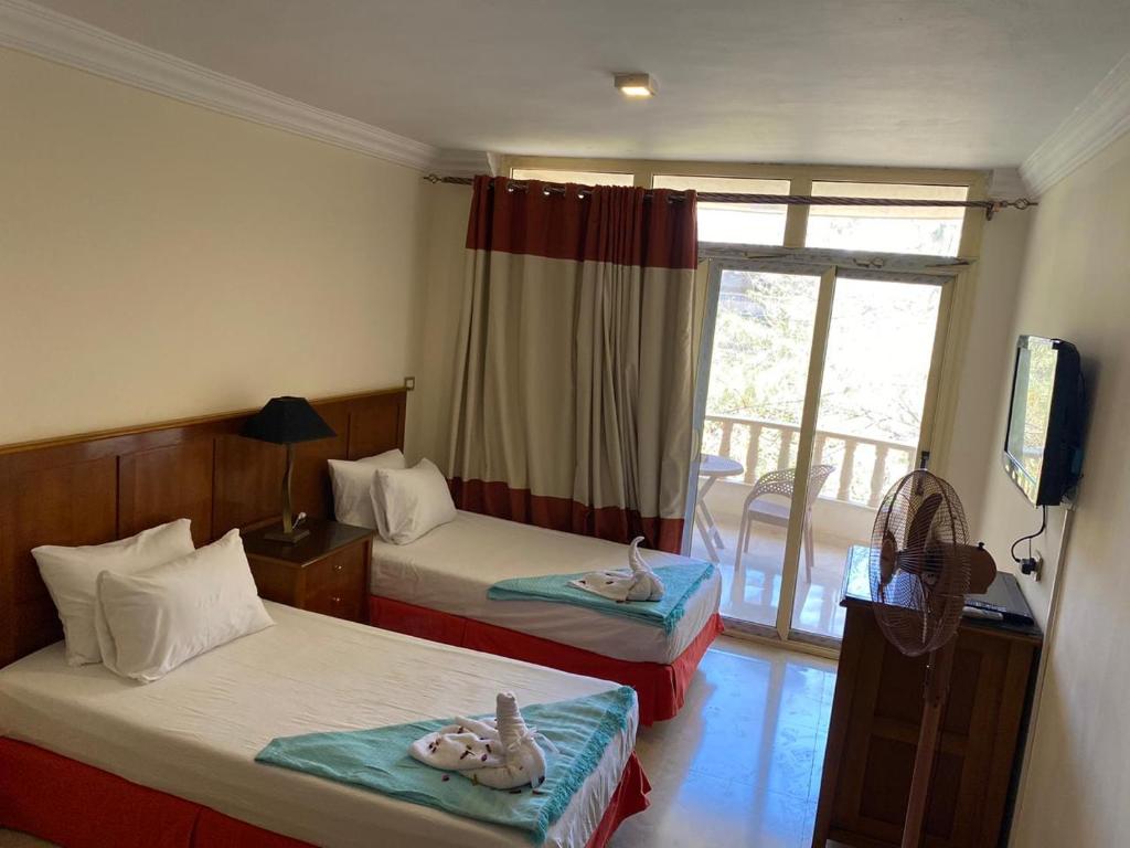 Postel nebo postele na pokoji v ubytování Bianchi Hotel
