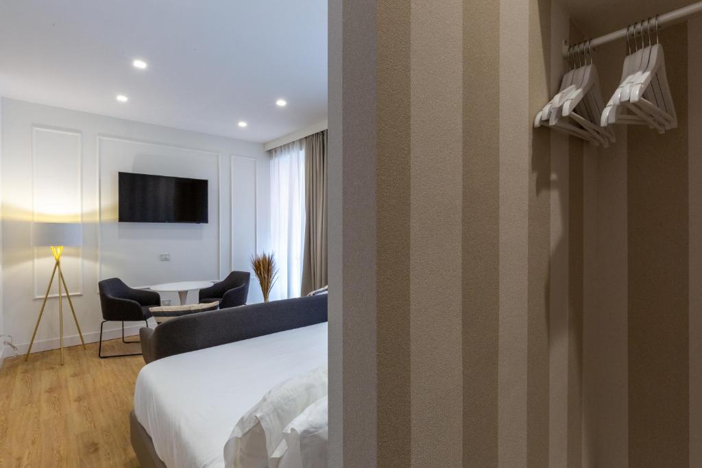 Postel nebo postele na pokoji v ubytování Casa Lounge Costituzione