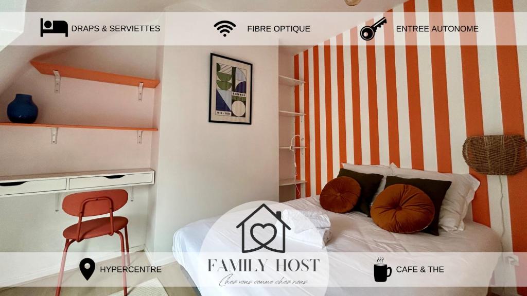 - une chambre avec un lit à rayures orange et blanche dans l'établissement Les toits de Saint-Cyr, à Nevers