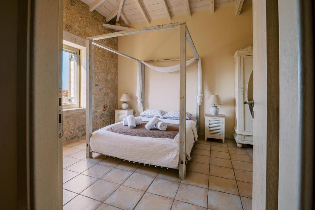 Postel nebo postele na pokoji v ubytování Riglia Villas