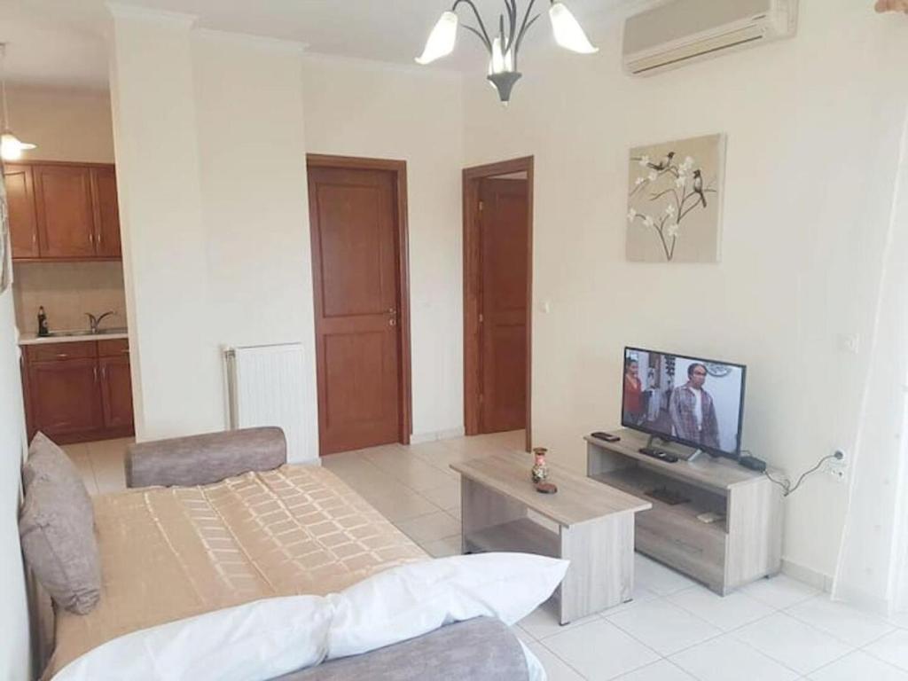 Televízia a/alebo spoločenská miestnosť v ubytovaní Rias Sea View Apartment