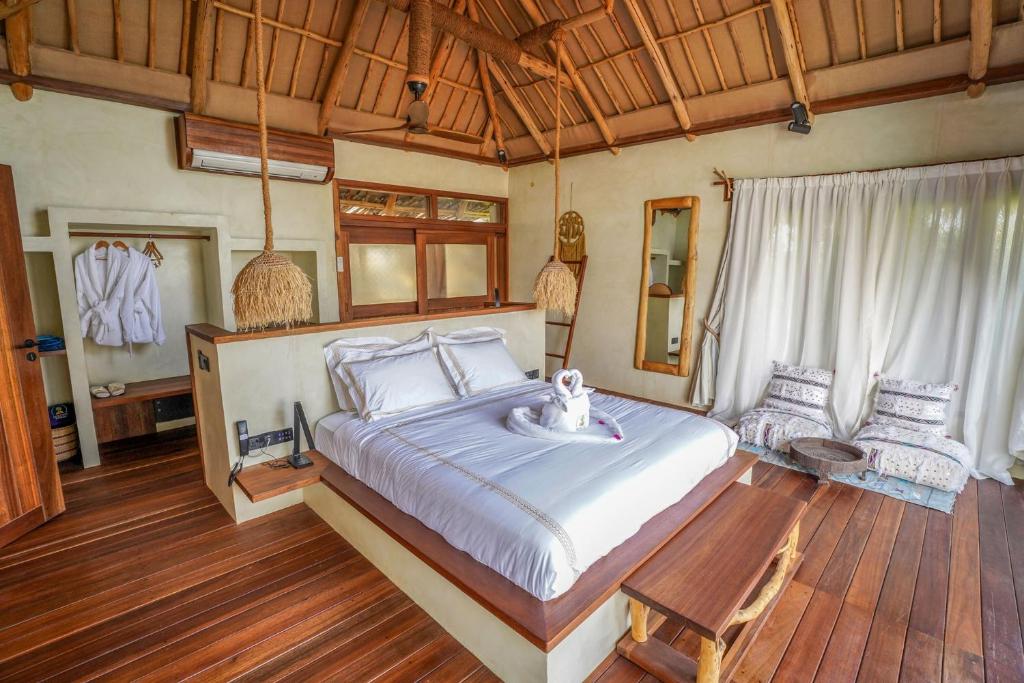 Postel nebo postele na pokoji v ubytování Casa Mikoko Resort