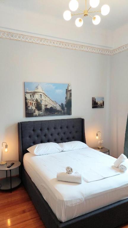 Posteľ alebo postele v izbe v ubytovaní Elegant apartment under the Acropolis