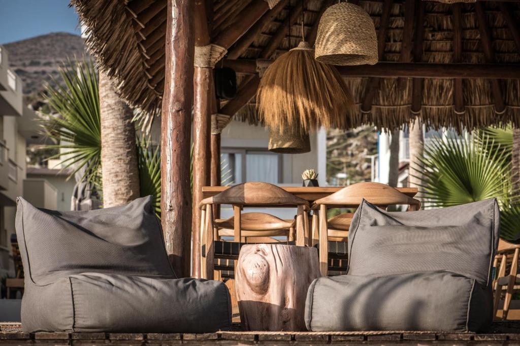a group of pillows on a porch of a resort at Soleil Rooms and Suites in Stalís