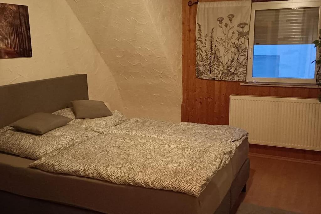 Postel nebo postele na pokoji v ubytování Ferienwohnung Birkenwäldchen