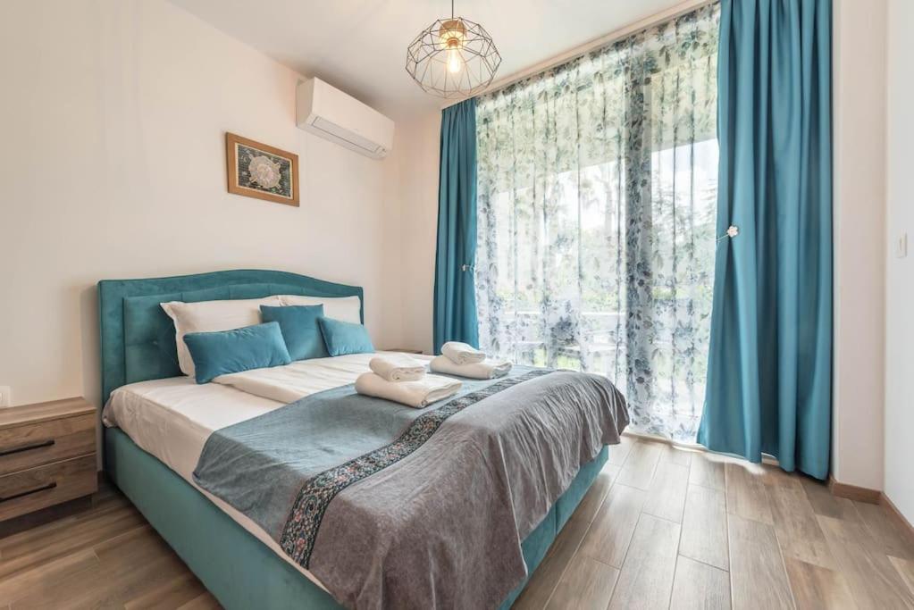 Postel nebo postele na pokoji v ubytování Azur Deluxe Apartment