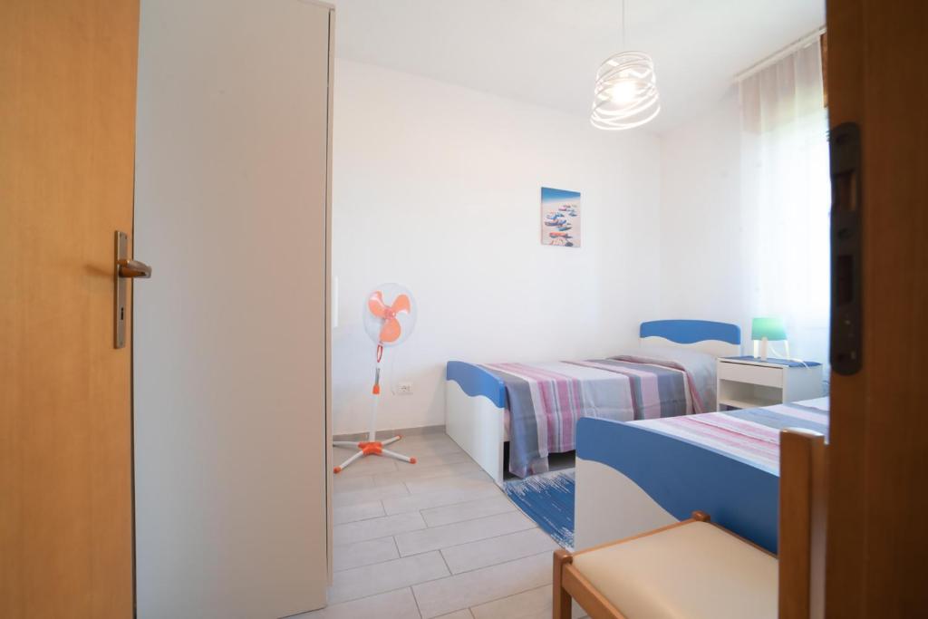 Postel nebo postele na pokoji v ubytování Azzurro lido adriano vista mare