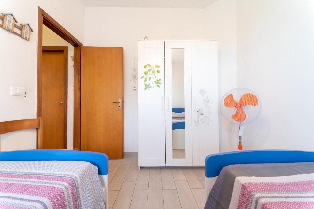 Postel nebo postele na pokoji v ubytování Azzurro lido adriano vista mare