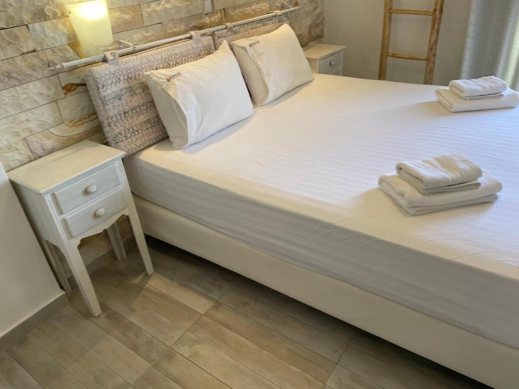 Posteľ alebo postele v izbe v ubytovaní Ioanna Apartments