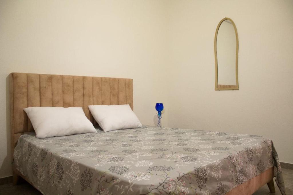 Postel nebo postele na pokoji v ubytování Maison de vacances Vue sur mer Gabes