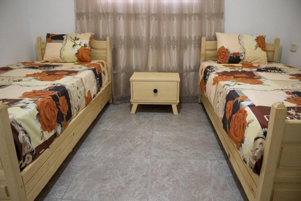 Postel nebo postele na pokoji v ubytování Maison de vacances Vue sur mer Gabes