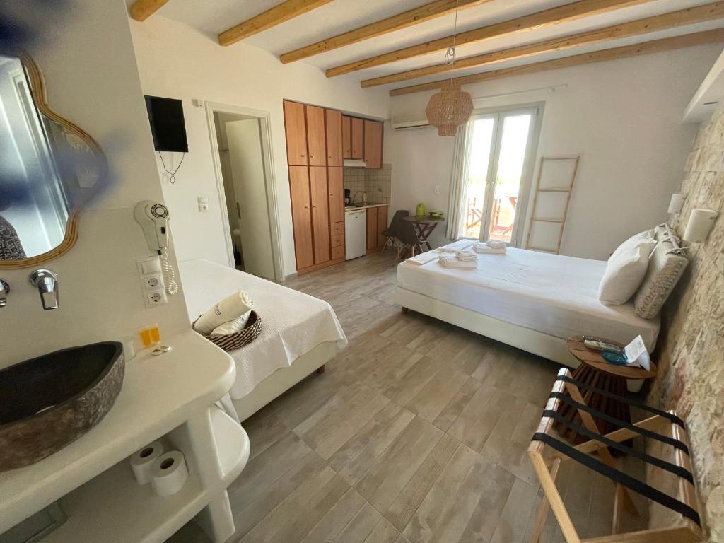 Posteľ alebo postele v izbe v ubytovaní Ioanna Apartments