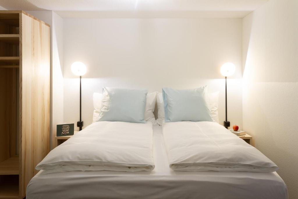 Postel nebo postele na pokoji v ubytování Hotel Schlüssel