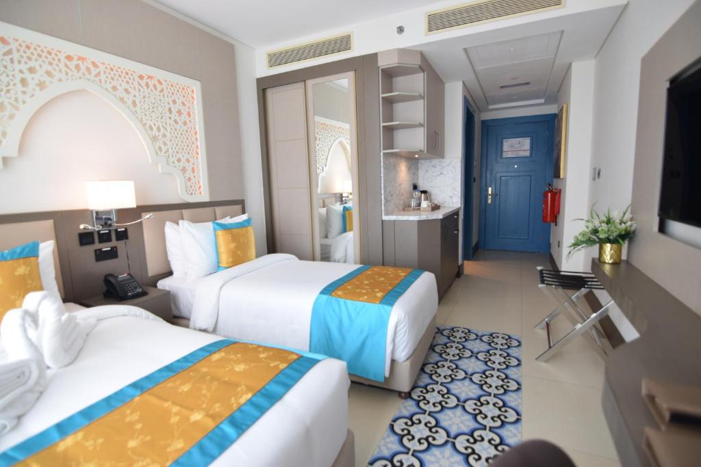 Postel nebo postele na pokoji v ubytování Central Inn Souq Waqif