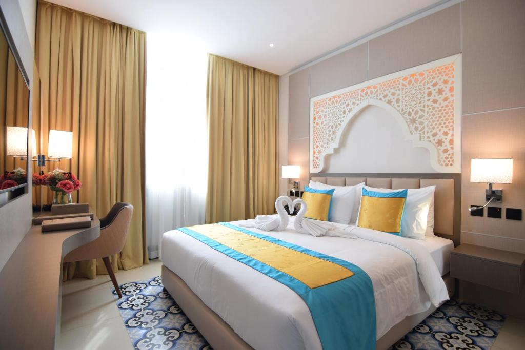 Postel nebo postele na pokoji v ubytování Central Inn Souq Waqif