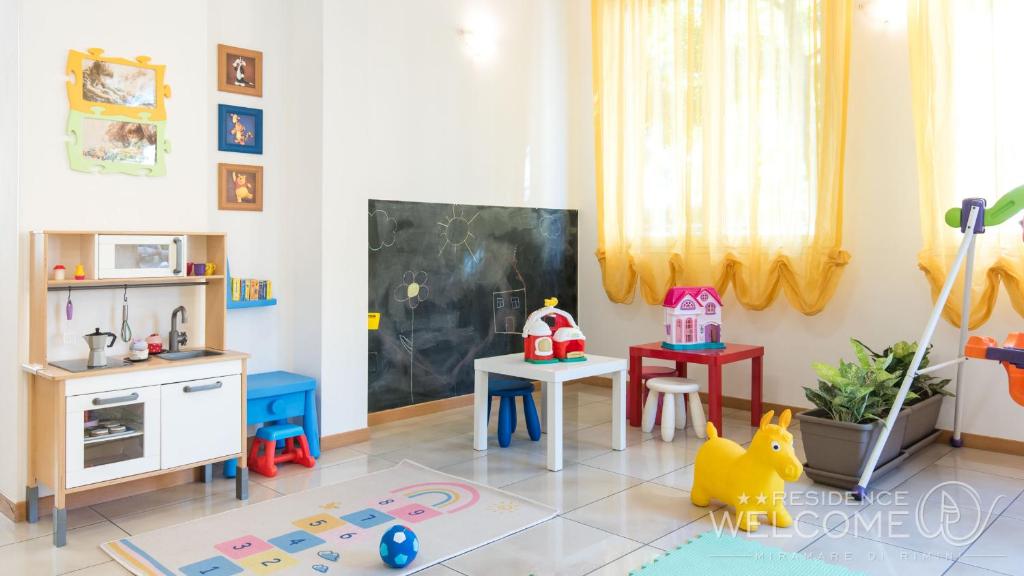 A kitchen or kitchenette at Welcome Residence per famiglie