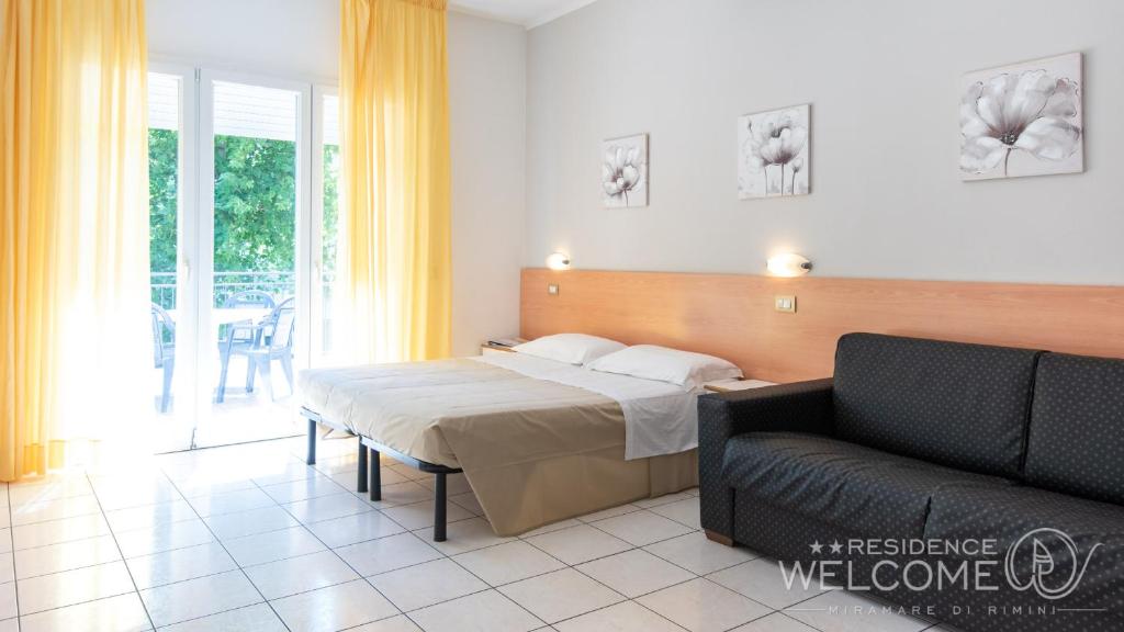 A bed or beds in a room at Welcome Residence per famiglie
