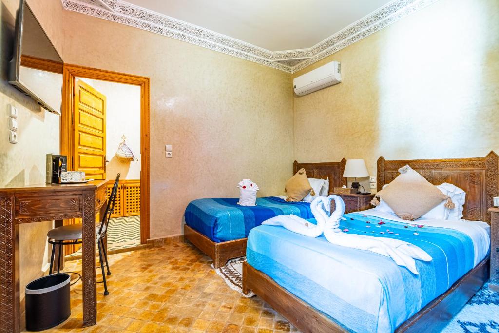 Postel nebo postele na pokoji v ubytování Riad N 15 Zefriti