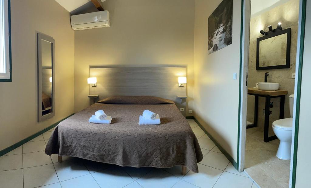 Postel nebo postele na pokoji v ubytování Hotel Clair de Lune
