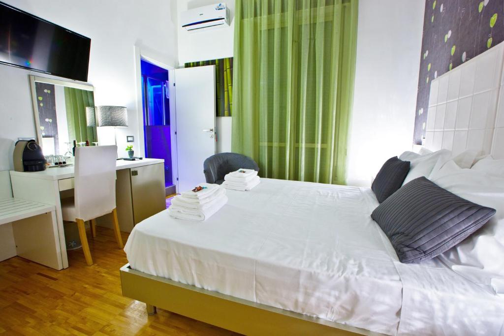 Letto o letti in una camera di B&B Pellicano Guest House