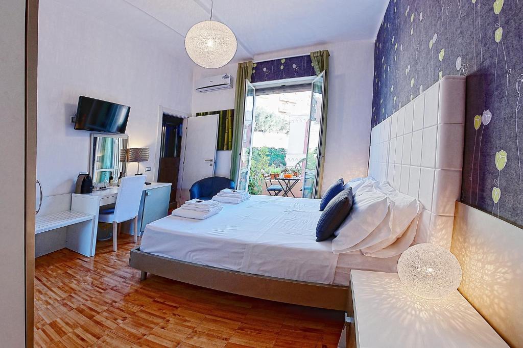 Letto o letti in una camera di B&B Pellicano Guest House