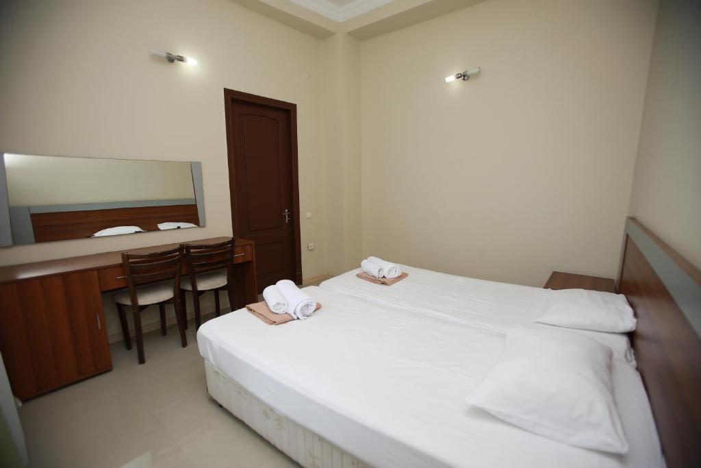 Postel nebo postele na pokoji v ubytování Green House Hotel