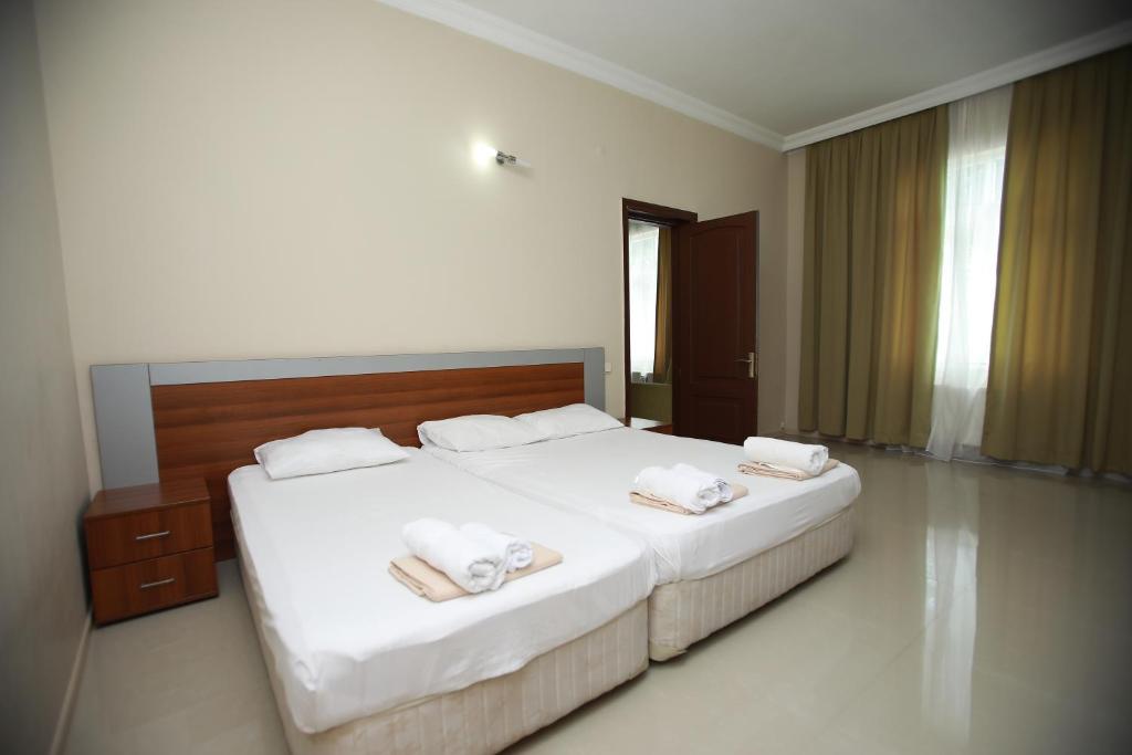 Postel nebo postele na pokoji v ubytování Green House Hotel