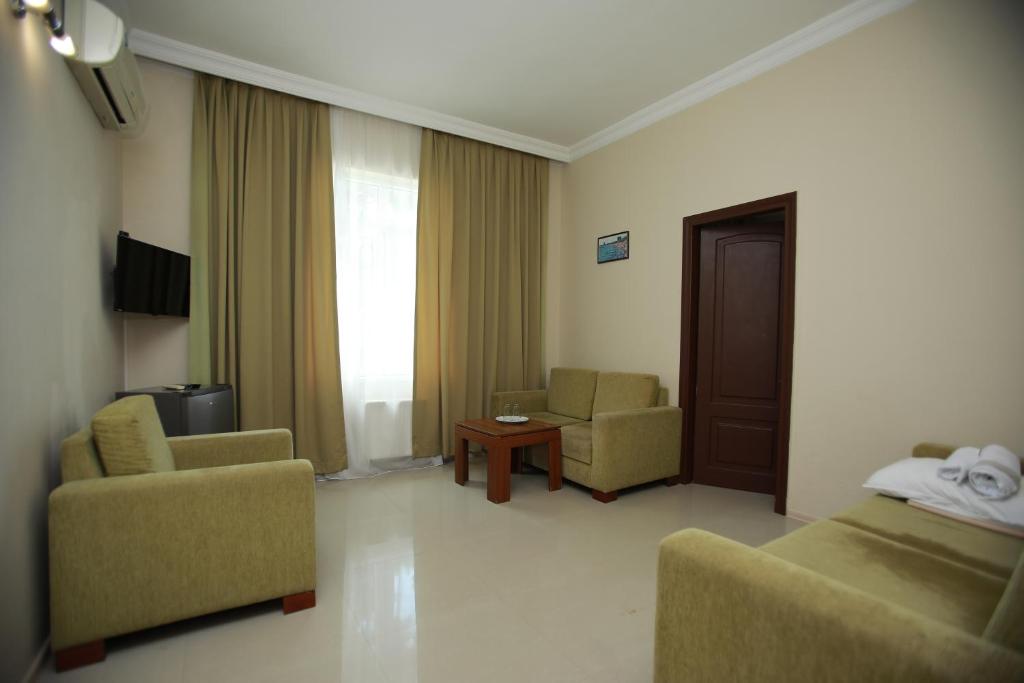 TV a/nebo společenská místnost v ubytování Green House Hotel