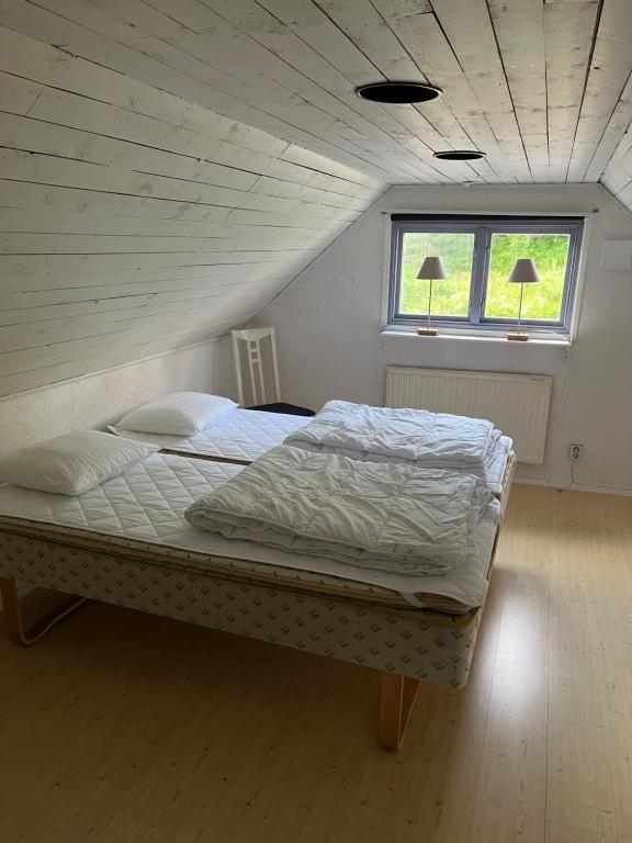 Postel nebo postele na pokoji v ubytování Härryda Husängen