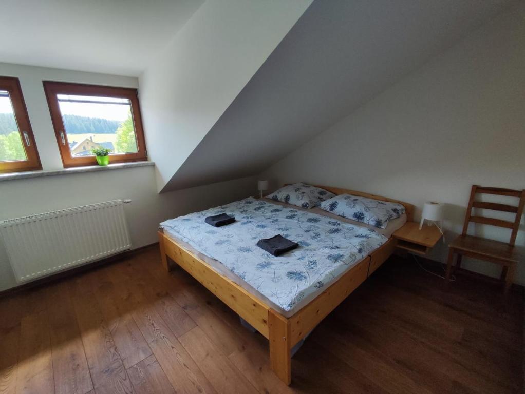 Postel nebo postele na pokoji v ubytování Apartmán Pivoňka