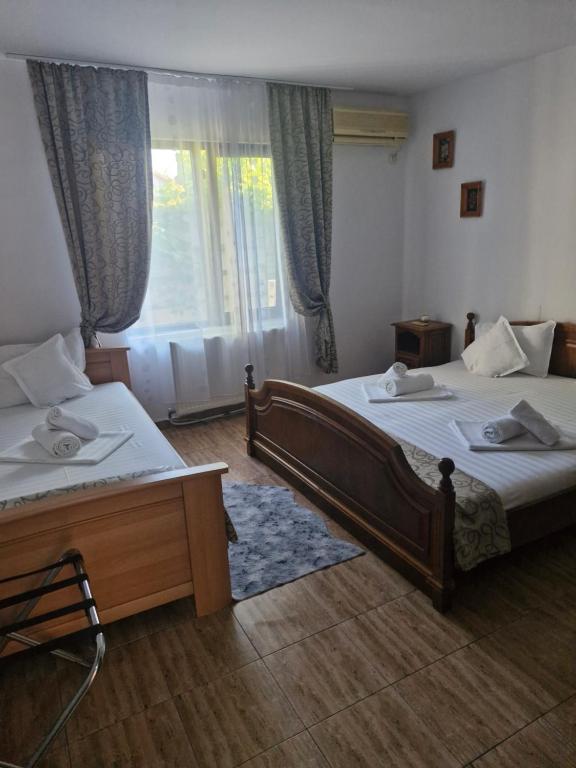 Postel nebo postele na pokoji v ubytování Casa Donau Beach