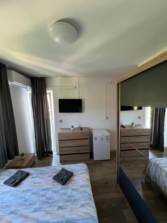 Postel nebo postele na pokoji v ubytování Apartmani Nika