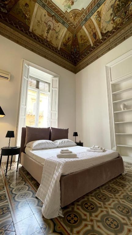 A bed or beds in a room at DonnaFrancaFlorio