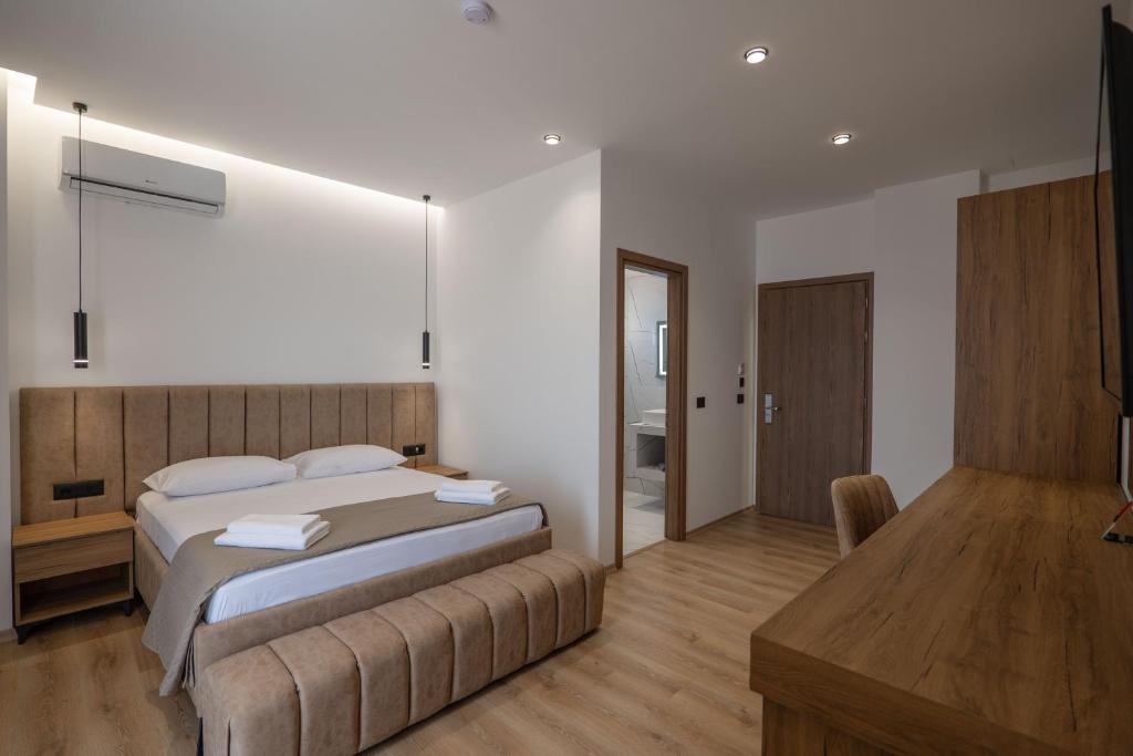 Postel nebo postele na pokoji v ubytování Keos Hotel