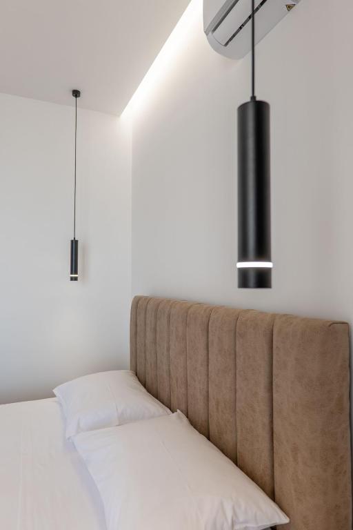 Postel nebo postele na pokoji v ubytování Keos Hotel