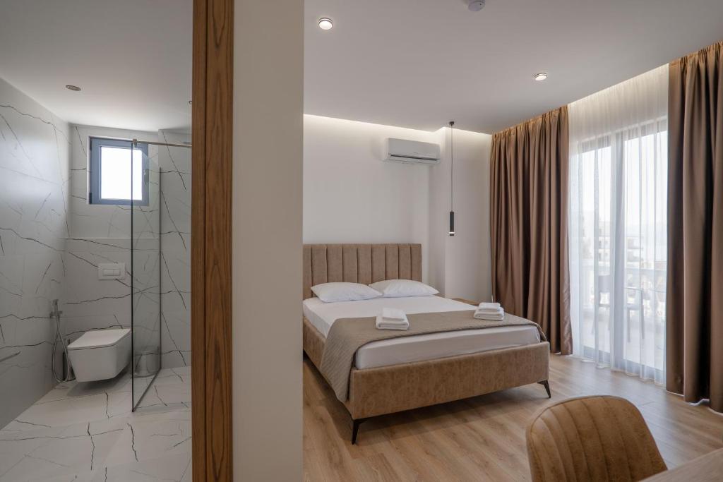 Postel nebo postele na pokoji v ubytování Keos Hotel