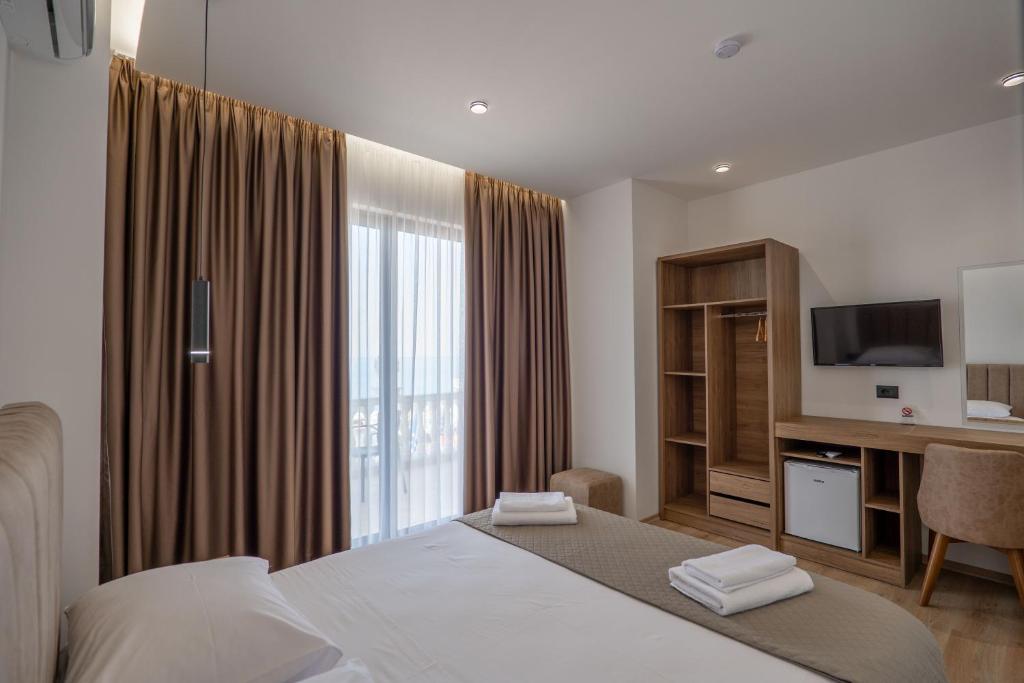Postel nebo postele na pokoji v ubytování Keos Hotel