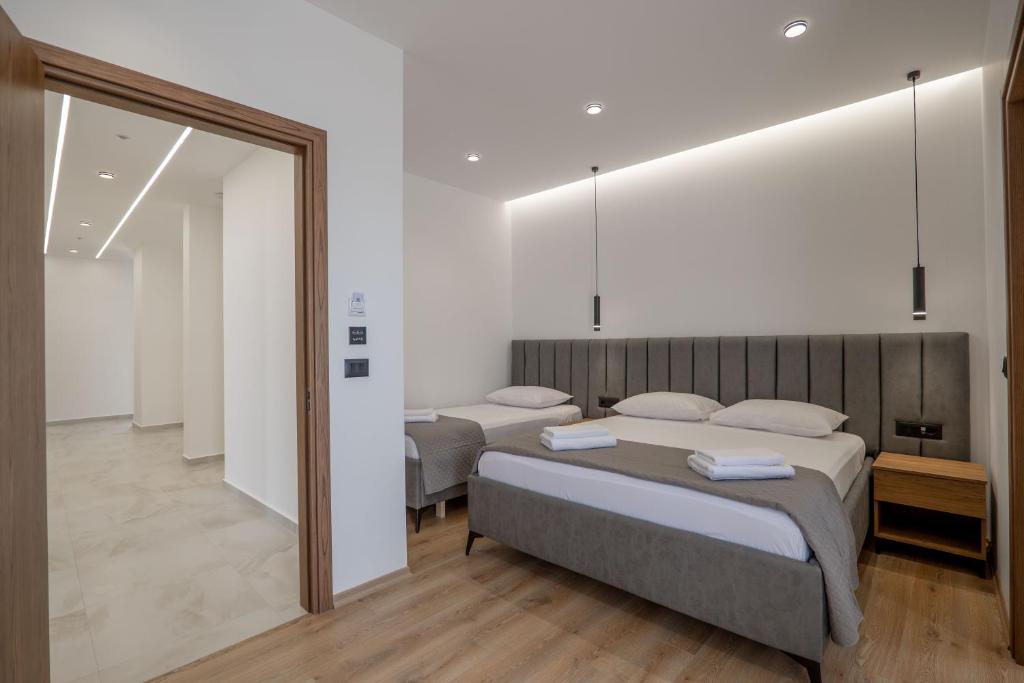 Postel nebo postele na pokoji v ubytování Keos Hotel
