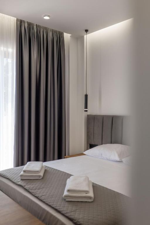 Postel nebo postele na pokoji v ubytování Keos Hotel