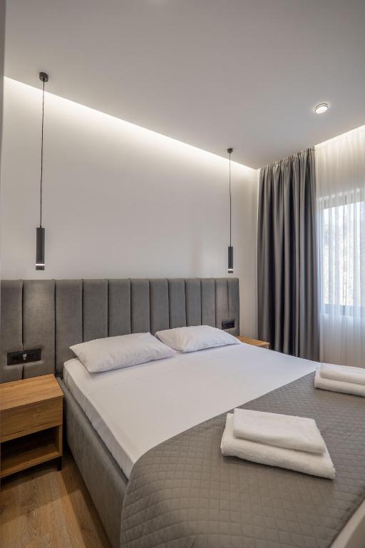 Postel nebo postele na pokoji v ubytování Keos Hotel