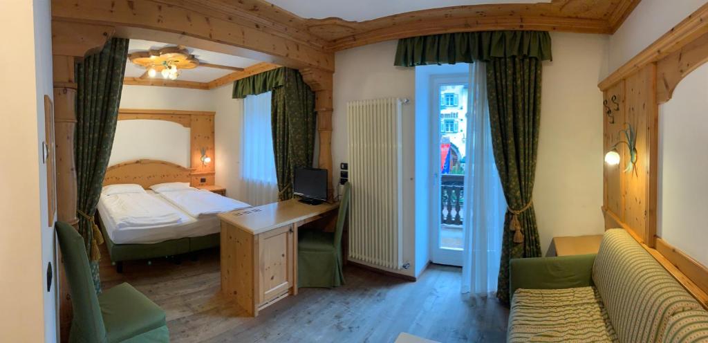 Posteľ alebo postele v izbe v ubytovaní Hotel Laurin