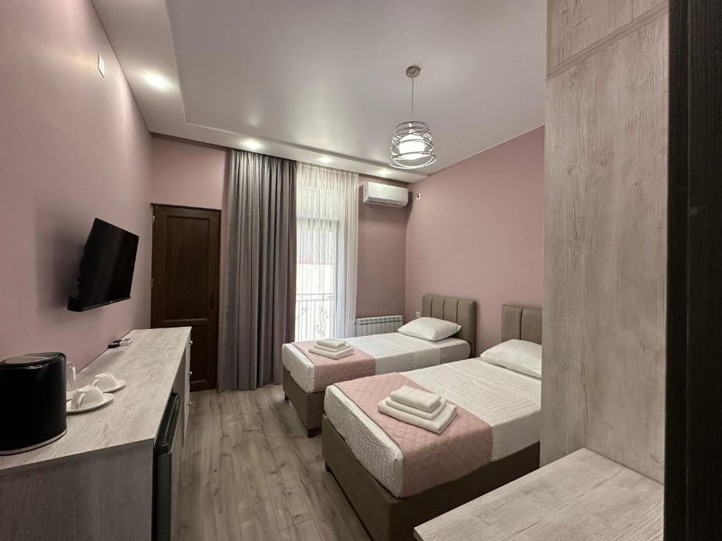 Letto o letti in una camera di Ameli Apartments BTM