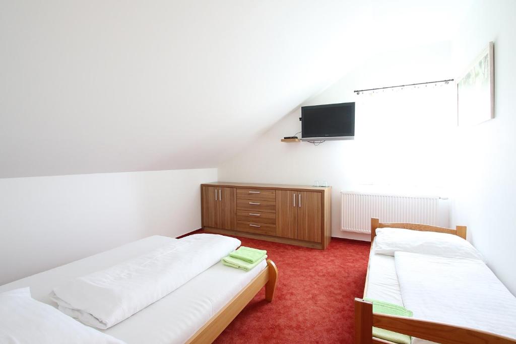 Postel nebo postele na pokoji v ubytování Apartmány HABURA