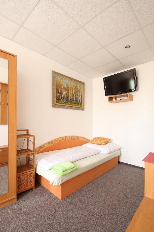 Postel nebo postele na pokoji v ubytování Apartmány HABURA