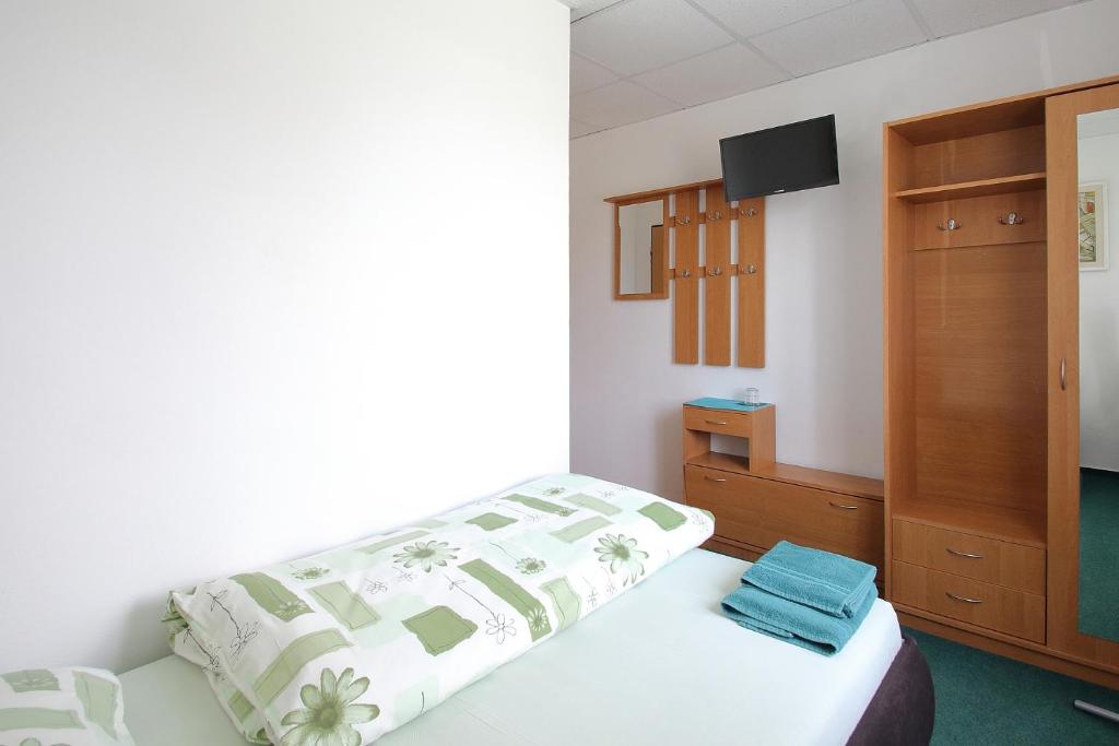 Postel nebo postele na pokoji v ubytování Apartmány HABURA