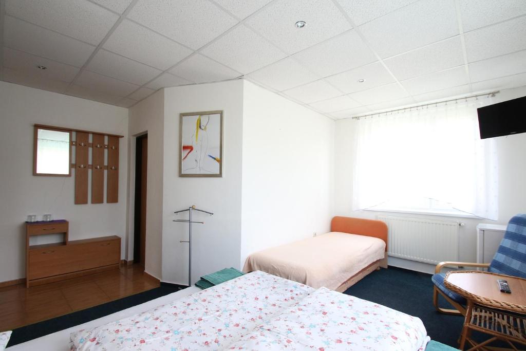 Postel nebo postele na pokoji v ubytování Apartmány HABURA