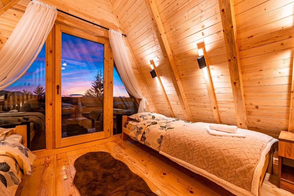 Postel nebo postele na pokoji v ubytování Mountain House Komovi-Radunovic DE LUX